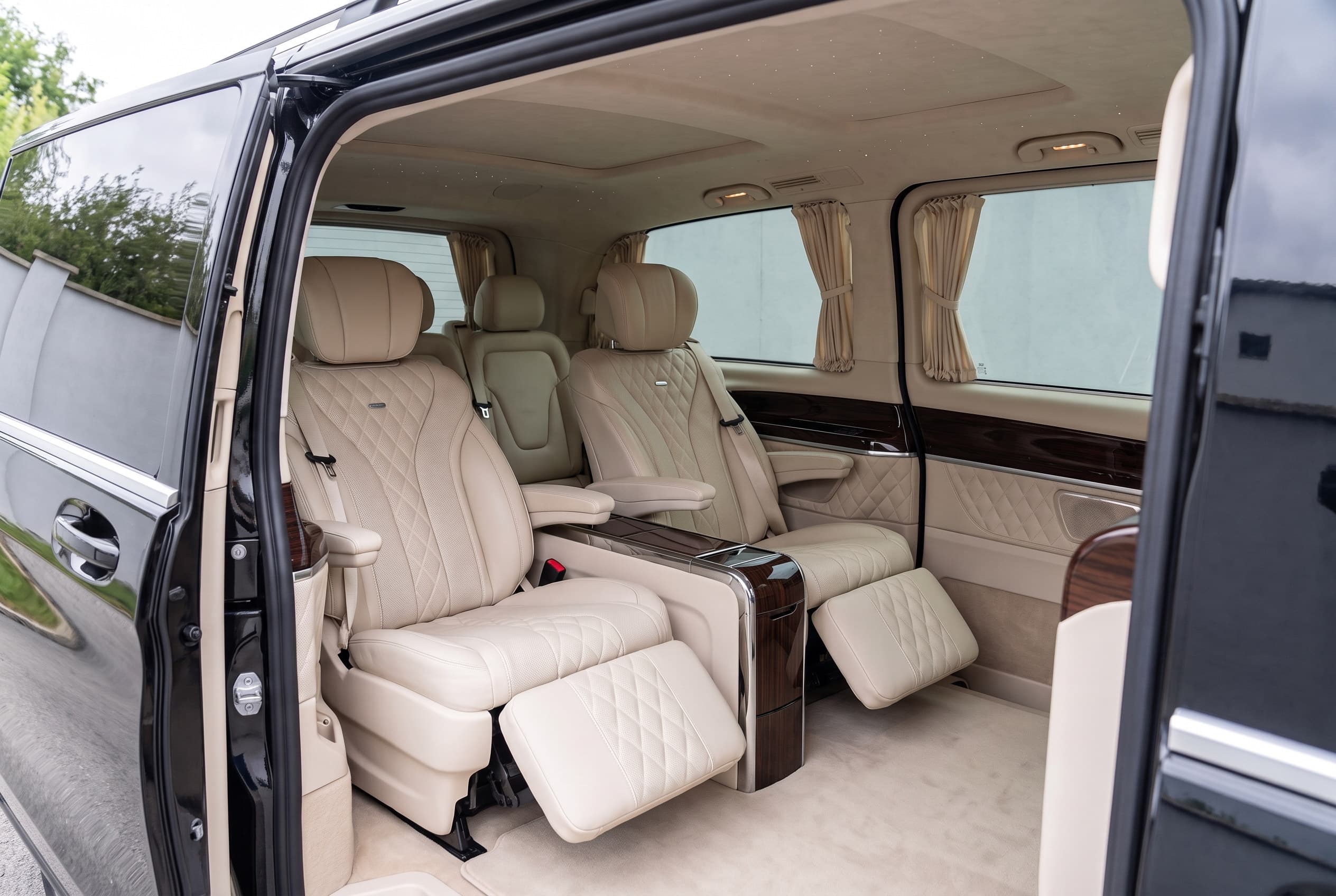 Cream quilted captain's chairs with leg rests in a Mercedes V-Class Exclusive